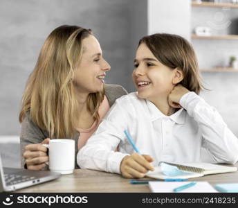 mother helping daughter study 2