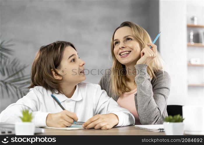 mother helping daughter study