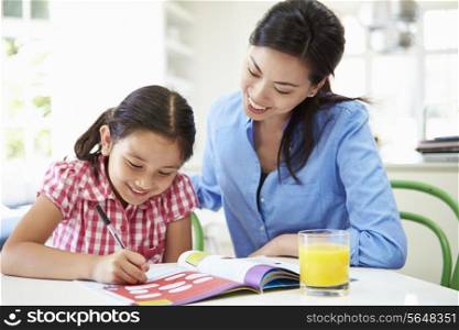 Mother Helping Daughter With Homework