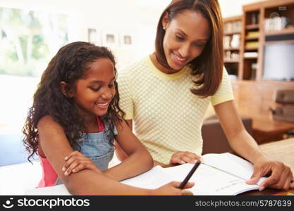 Mother Helping Daughter With Homework