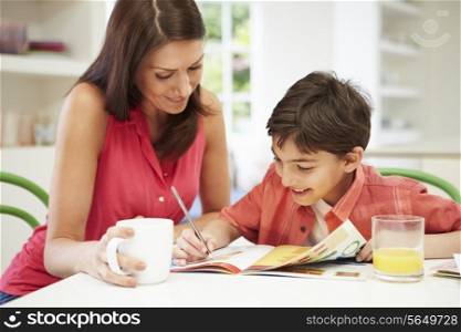 Mother Helping Son With Homework