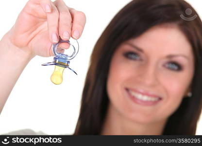 Mother holding a baby soother