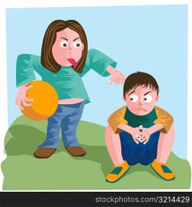 Mother holding a ball and scolding her son