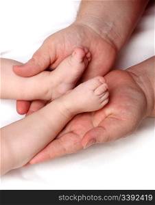 mother holding baby foots on her palms