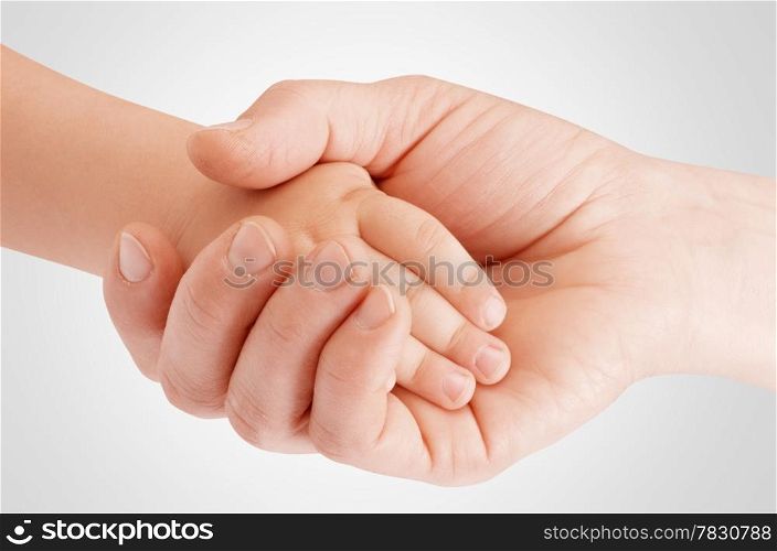 Mother holding child&rsquo;s hand