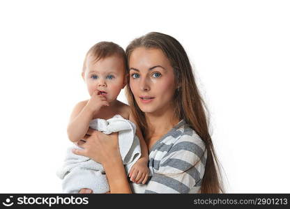 mother holding cute baby in white towel at home