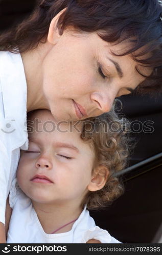 Mother hugging and daughter, maternal tenderness