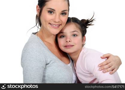 Mother hugging her daughter