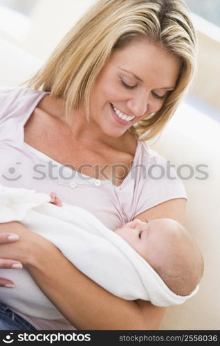 Mother in living room with baby smiling