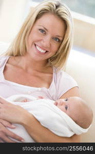 Mother in living room with baby smiling