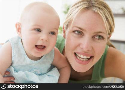 Mother in living room with baby smiling
