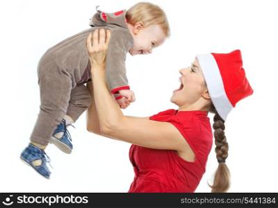 Mother in Santa&rsquo;s hat playing with baby