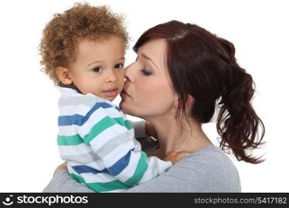 Mother kissing her little boy