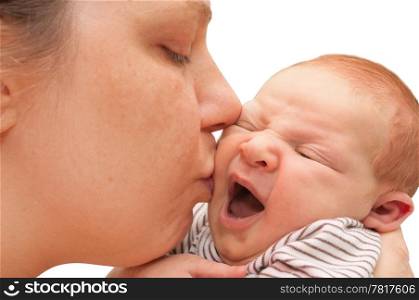 Mother Kissing Yawning Newborn Baby - on White Background