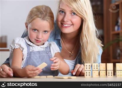 Mother playing with daughter