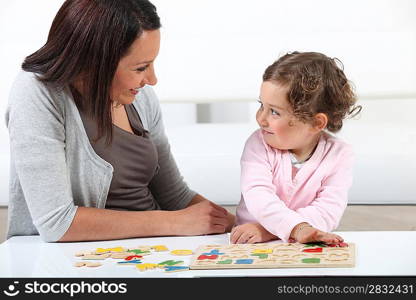 mother playing with her daughter