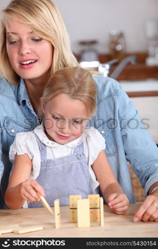 Mother playing with her daughter