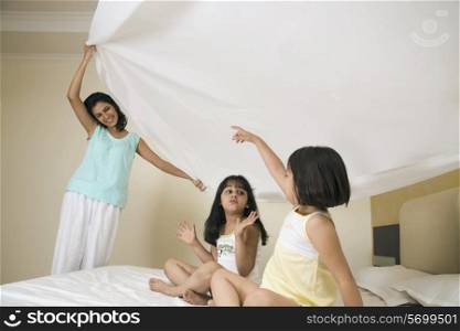 Mother playing with her daughters