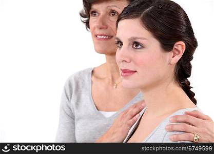 Mother putting her hands on her daughter&acute;s shoulders