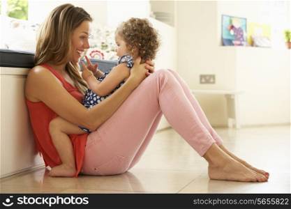 Mother Sitting With Daughter At Home