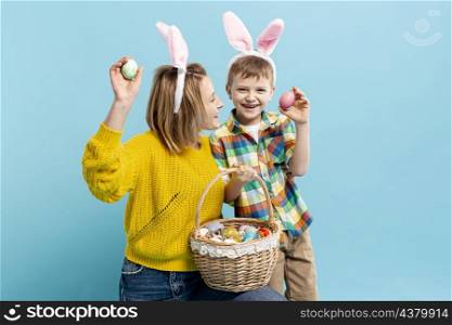 mother son holding painted egg