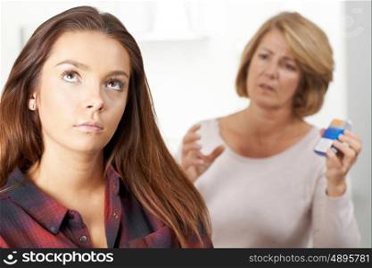 Mother Talking To Teenage Daughter About Dangers Of Smoking