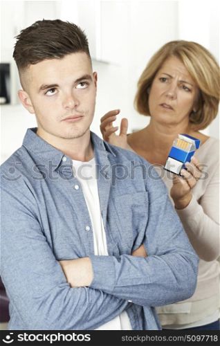 Mother Talking To Teenage Son About Dangers Of Smoking