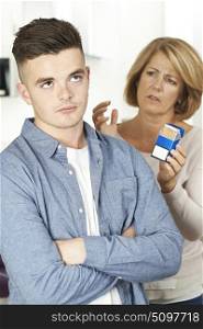 Mother Talking To Teenage Son About Dangers Of Smoking