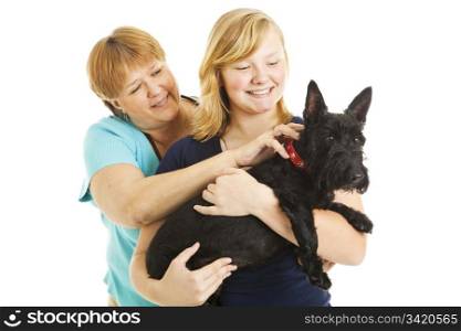 Mother, teen daughter, and adorable Scotty dog. Isolated on white.