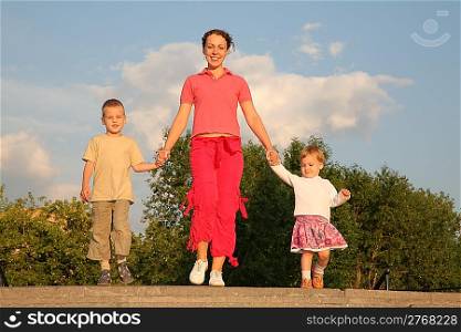 Mother walks with children