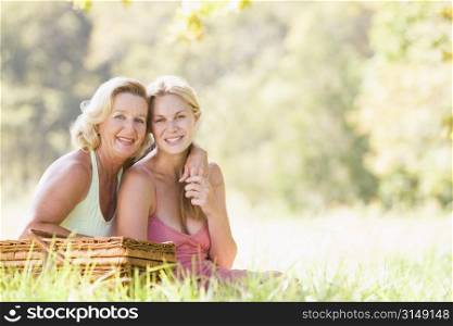 Mother with adult daughter on picnic