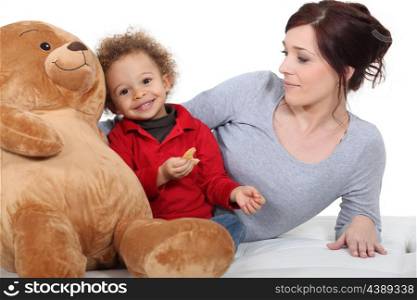 Mother with baby and teddy bear