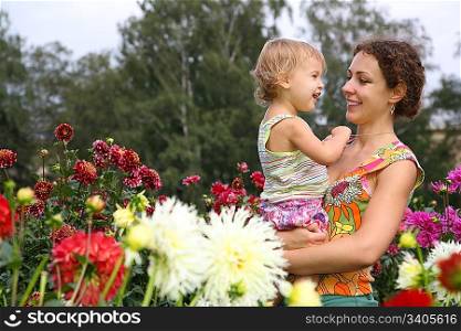 mother with baby in flowers