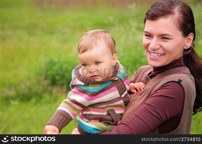 Mother with baby on nature