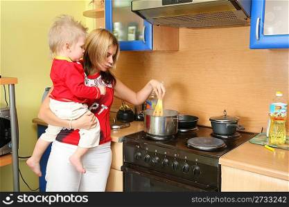 mother with child on kitchen