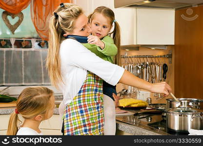 Mother with children having a lot of stress doing the homework