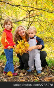 mother with children in autumn park