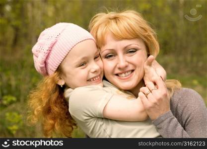 Mother with daughter outside