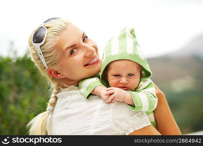 Mother with her adorable baby outdoors