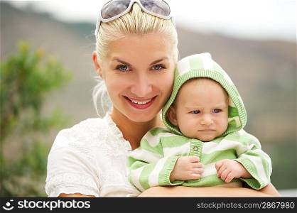 Mother with her adorable baby outdoors