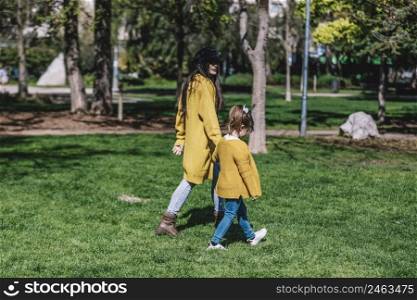 Mother with her baby. Mom and daughter in autumn park