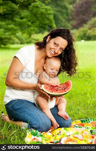 Mother with her child outdoors.