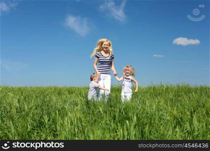 mother with her children outdoors in summer day