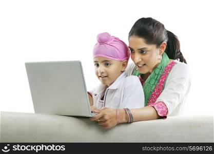 Mother with her son looking at a laptop