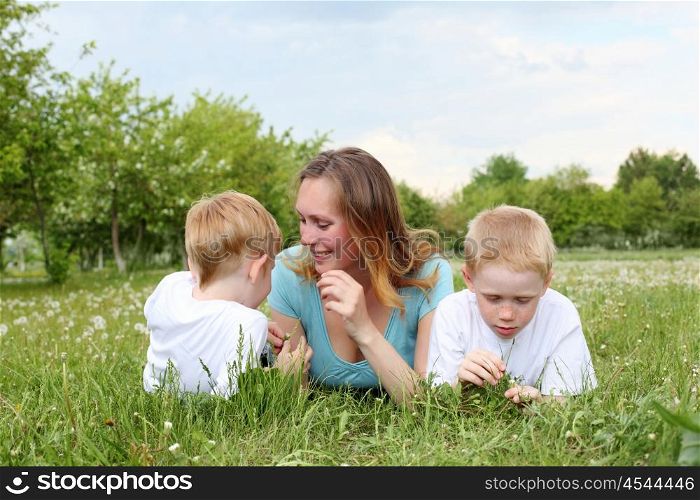 mother with her two sons outdoors together