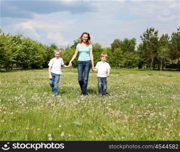 mother with her two sons outdoors together