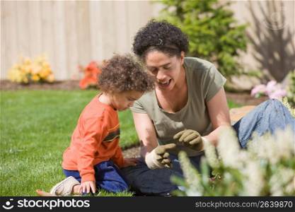 Mother with son (2-3) in garden