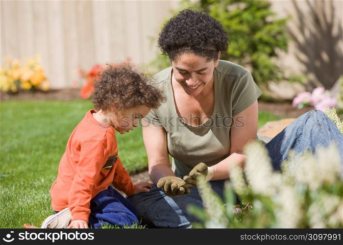 Mother with son (2-3) in garden
