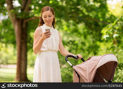 motherhood, technology and people concept - happy mother with smartphone and baby girl stroller at summer park. happy mother with smartphone and stroller at park