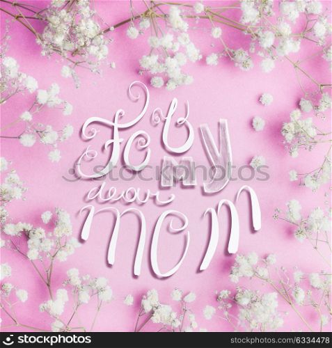 Mothers day greeting card with For my dear mom lettering and lovely little white Gypsophila flowers on pastel pink background, square